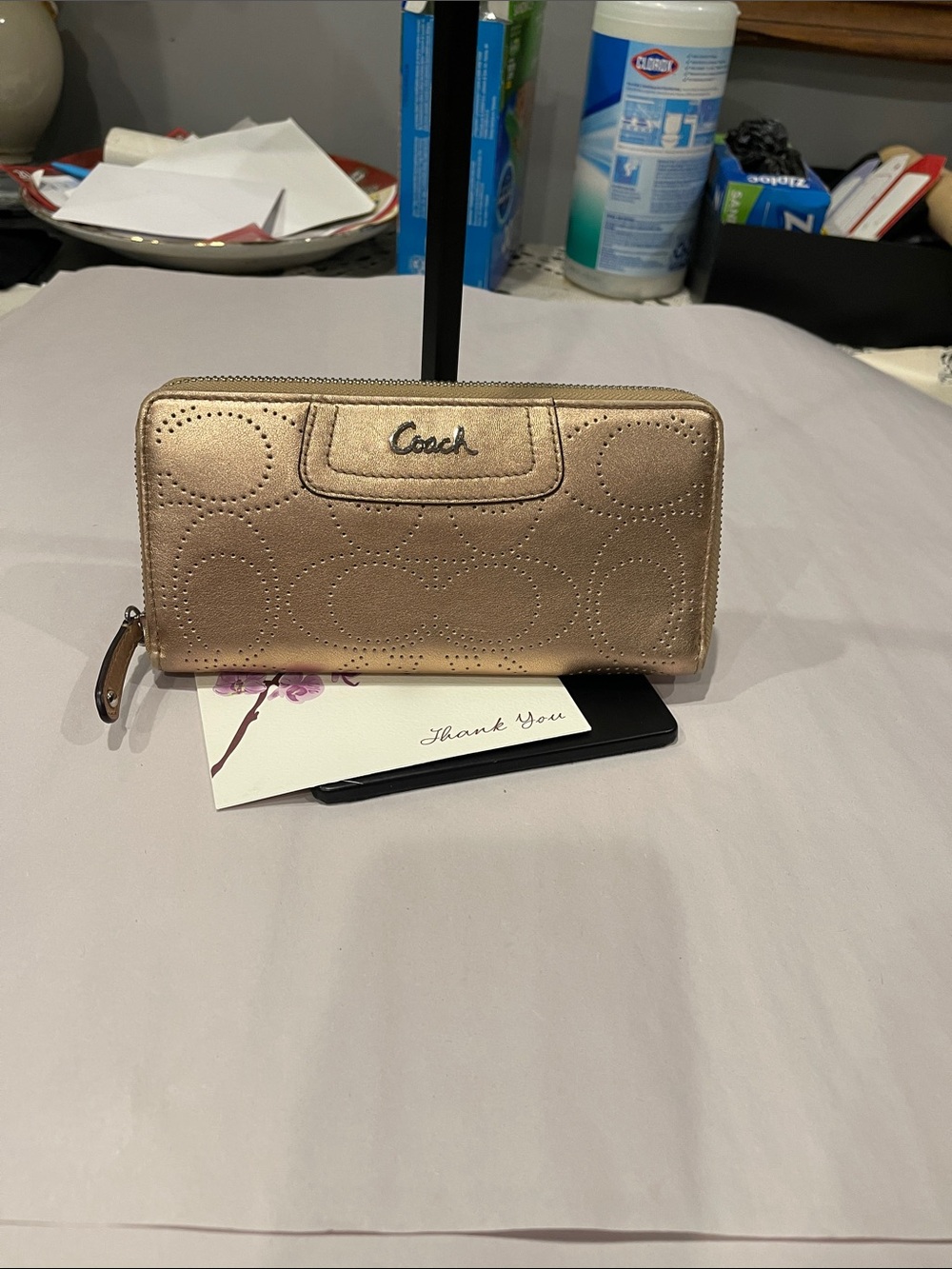 Coach Ashley perforated zip-around wallet.